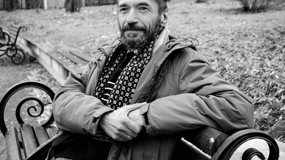 a man sitting on a bench